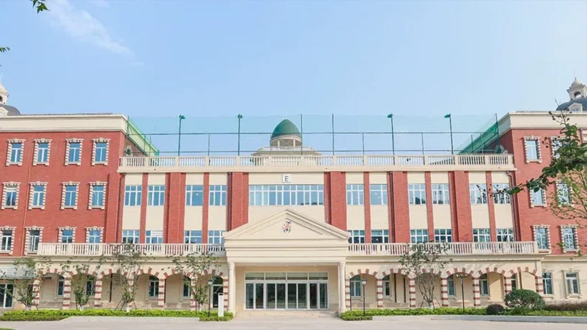 Wellington College International Hangzhou campus with red brick facade and green domes
