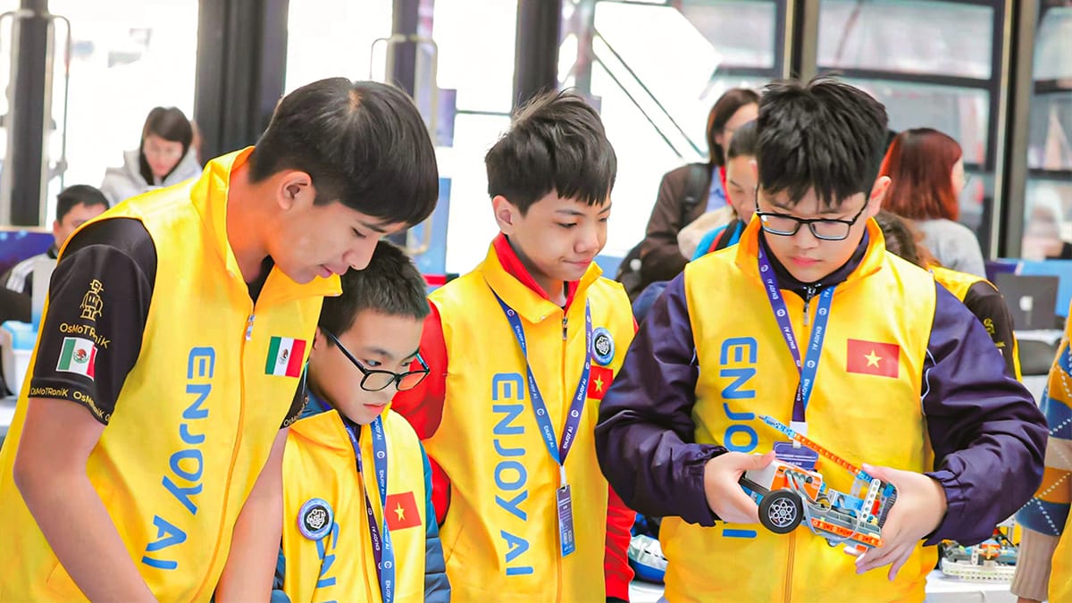 STEM Study Tours students from different countries collaborating on robotics project