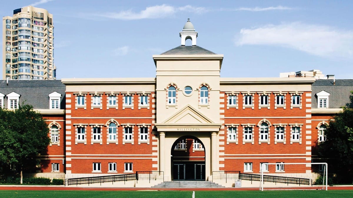 Wellington College International Tianjin red brick building with cupola and arched entrance