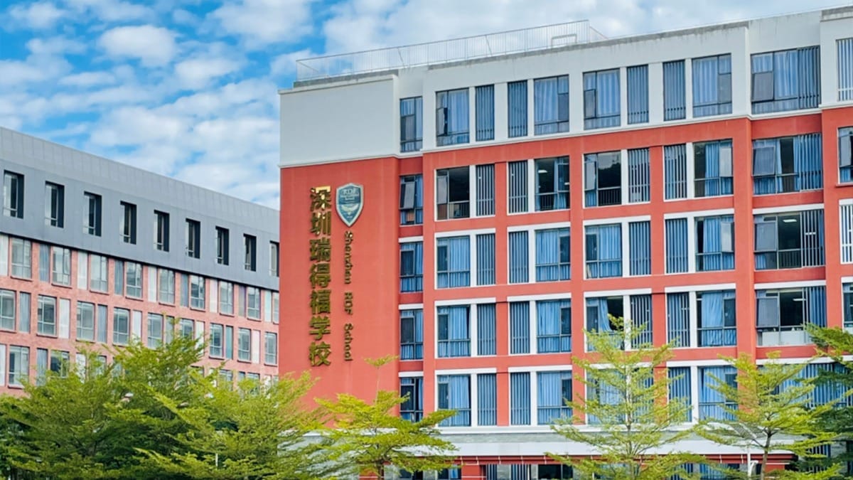 RDF International School orange and white building exterior with green landscaping