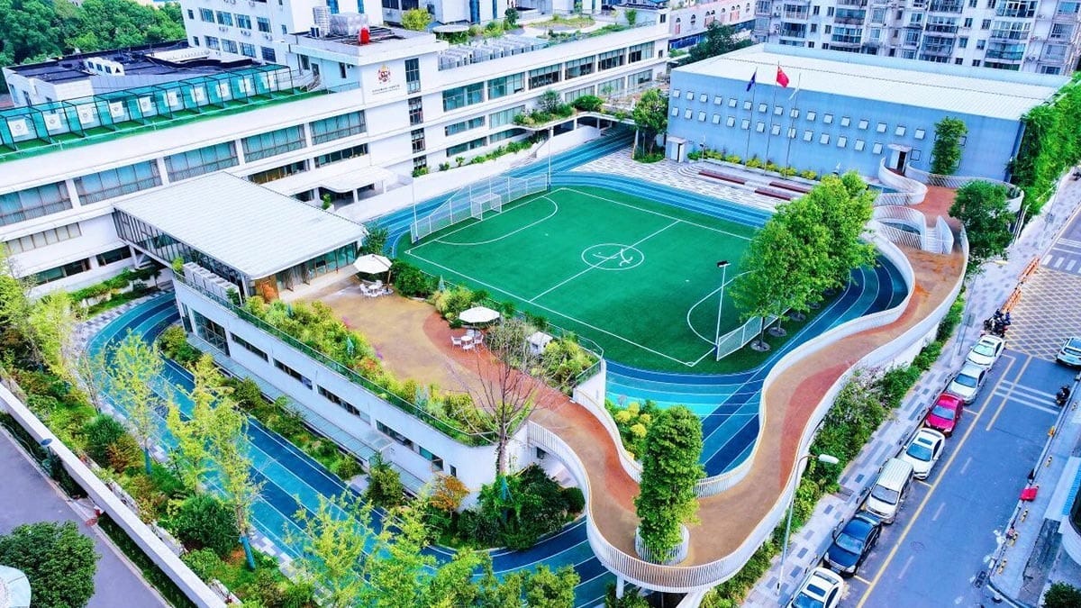Changsha BeeMee Forest School (CBFS) aerial view with rooftop soccer field and track