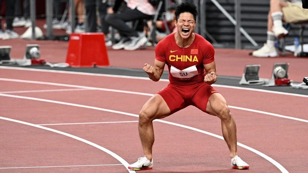Track & Field Sports Schools China U18 athlete celebrating sprint race victory