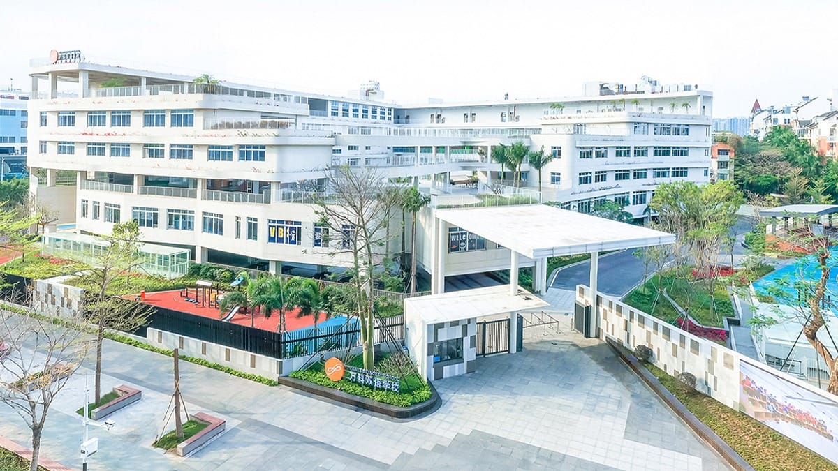 Shenzhen Vanke Bilingual School aerial view with white campus and playground